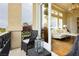 Cozy balcony with outdoor seating offers a tranquil retreat with an inviting glimpse into the living room at 1704 Wincanton Dr, Las Vegas, NV 89134