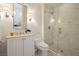 White marble bathroom features an enclosed glass shower and updated vanity at 1704 Wincanton Dr, Las Vegas, NV 89134