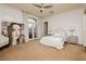Bright bedroom with decorative artwork and balcony access, offering a serene space to unwind at 1704 Wincanton Dr, Las Vegas, NV 89134