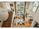 Bright, soaring dining room with view of backyard and spiral staircase at 1704 Wincanton Dr, Las Vegas, NV 89134