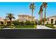 Stunning two-story home featuring manicured landscaping and mature palm trees, creating a grand entrance at 1704 Wincanton Dr, Las Vegas, NV 89134
