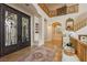 Grand foyer entry with soaring ceilings, beautiful staircase and double doors at 1704 Wincanton Dr, Las Vegas, NV 89134