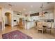 Open kitchen with granite counters, island, and adjacent dining area at 1704 Wincanton Dr, Las Vegas, NV 89134