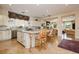 Bright, open kitchen featuring stainless steel appliances, a large island, and natural light at 1704 Wincanton Dr, Las Vegas, NV 89134
