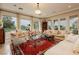 Bright living room showcasing large windows and stylish furnishings for a comfortable living space at 1704 Wincanton Dr, Las Vegas, NV 89134