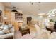Bright living room featuring custom built-ins, a skylight, and comfortable seating, creating a cozy atmosphere at 1704 Wincanton Dr, Las Vegas, NV 89134