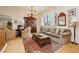 Cozy living room with a decorative rug, comfortable seating, and built-in bookshelves at 1704 Wincanton Dr, Las Vegas, NV 89134