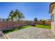 Fully-fenced backyard boasts hardscape, turf, playset and trampoline, perfect for Gathering fun at 1809 Lazy Hill Ranch Way, North Las Vegas, NV 89081