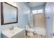 Cozy bathroom featuring a tub/shower combo, a modern vanity, and neutral wall and floor tones at 1809 Lazy Hill Ranch Way, North Las Vegas, NV 89081