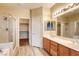 Bathroom with double sinks, shower, and large mirror at 1809 Lazy Hill Ranch Way, North Las Vegas, NV 89081