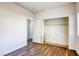 Bedroom featuring wood floors and closet space at 1809 Lazy Hill Ranch Way, North Las Vegas, NV 89081