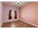 Cozy bedroom with a window and wood flooring at 1809 Lazy Hill Ranch Way, North Las Vegas, NV 89081