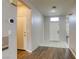 Welcoming entryway with tile and wood flooring, leading to a bright interior with neutral walls at 1809 Lazy Hill Ranch Way, North Las Vegas, NV 89081
