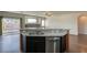 Kitchen island with stainless steel dishwasher, granite countertop, and double sink at 1809 Lazy Hill Ranch Way, North Las Vegas, NV 89081