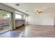 Open living area with dark wood floors, sliding glass doors to the backyard, and plenty of natural light at 1809 Lazy Hill Ranch Way, North Las Vegas, NV 89081