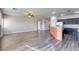 Expansive living space featuring modern dark wood floors, neutral walls, and an open floor plan at 1809 Lazy Hill Ranch Way, North Las Vegas, NV 89081