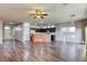 Spacious living area with dark wood floors and a modern open layout, perfect for entertaining at 1809 Lazy Hill Ranch Way, North Las Vegas, NV 89081