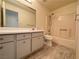 Bright bathroom with a white vanity, toilet, shower and tub combo, and wood-look flooring at 2064 Mesquite Ln # 303, Laughlin, NV 89029