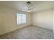 Empty bedroom featuring a ceiling fan and a bright window at 2064 Mesquite Ln # 303, Laughlin, NV 89029