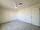 This bedroom has a ceiling fan, neutral walls, and light gray wood-look flooring at 2064 Mesquite Ln # 303, Laughlin, NV 89029