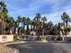 Exterior view of the gated community with desert landscaping, building 2000, and palm trees at 2064 Mesquite Ln # 303, Laughlin, NV 89029