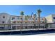 Exterior view of the property showing the building and palm trees in front at 2064 Mesquite Ln # 303, Laughlin, NV 89029
