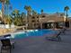 Community pool with lounge chairs and shade; perfect for relaxing on a sunny day at 2064 Mesquite Ln # 303, Laughlin, NV 89029
