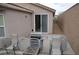 Backyard view of covered patio with desert landscaping and no grass at 2679 Lochleven Way, Henderson, NV 89044