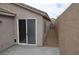 View of backyard with a patio and desert landscaping with no grass at 2679 Lochleven Way, Henderson, NV 89044