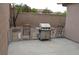 View of backyard featuring patio with desert landscaping and a grill at 2679 Lochleven Way, Henderson, NV 89044