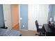 Bedroom with closet and a doorway, with desk and chair at 2679 Lochleven Way, Henderson, NV 89044