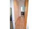 Hallway with wood flooring and a view into a bedroom at 2679 Lochleven Way, Henderson, NV 89044