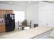Bright kitchen with black appliances, wood cabinets, and breakfast nook at 2679 Lochleven Way, Henderson, NV 89044