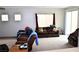 Spacious living room featuring a carpeted floor and comfortable furniture at 2679 Lochleven Way, Henderson, NV 89044