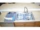 Stainless steel kitchen sink with a sleek faucet and modern dish-drying rack at 2679 Lochleven Way, Henderson, NV 89044