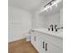 Bright bathroom with a modern vanity, sleek black fixtures, and a large mirror at 2725 S Nellis Blvd # 1033, Las Vegas, NV 89121
