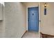 Charming blue front door with decorative hardware and updated exterior lighting at 2725 S Nellis Blvd # 1033, Las Vegas, NV 89121