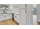 Modern kitchen with stainless steel appliances, white cabinets, and hardwood floors at 2725 S Nellis Blvd # 1033, Las Vegas, NV 89121
