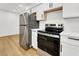 Well-equipped kitchen featuring stainless steel appliances, and hardwood floors at 2725 S Nellis Blvd # 1033, Las Vegas, NV 89121