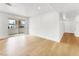 Bright living room featuring hardwood floors, sliding glass doors, and neutral paint at 2725 S Nellis Blvd # 1033, Las Vegas, NV 89121