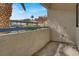 Cozy outdoor patio with a low wall, decorative concrete texture, and exterior views at 2725 S Nellis Blvd # 1033, Las Vegas, NV 89121