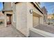 Home's exterior has stone accents, a private drive, and a red front door at 31 Castleton Tower Ct, Henderson, NV 89011