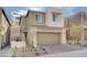 Charming two-story home with a two-car garage and landscaped front yard at 31 Castleton Tower Ct, Henderson, NV 89011