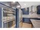 Modern kitchen features stainless steel appliances and custom cabinets at 31 Castleton Tower Ct, Henderson, NV 89011