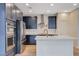 Modern kitchen features stainless steel appliances and a spacious island at 31 Castleton Tower Ct, Henderson, NV 89011