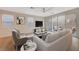 Bright living room with large windows and neutral decor at 31 Castleton Tower Ct, Henderson, NV 89011