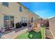 Fully fenced backyard with patio, grass, and mature landscape at 3164 Bormida Ave, Henderson, NV 89044