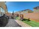 Backyard with patio area, slide, and lovely landscaping at 3164 Bormida Ave, Henderson, NV 89044