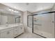 Modern bathroom with a large shower, dual sinks, and tile flooring at 3164 Bormida Ave, Henderson, NV 89044