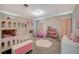 Playful bedroom featuring a bunk bed, charming decor, and a hexagon rug on carpeted floors at 3164 Bormida Ave, Henderson, NV 89044